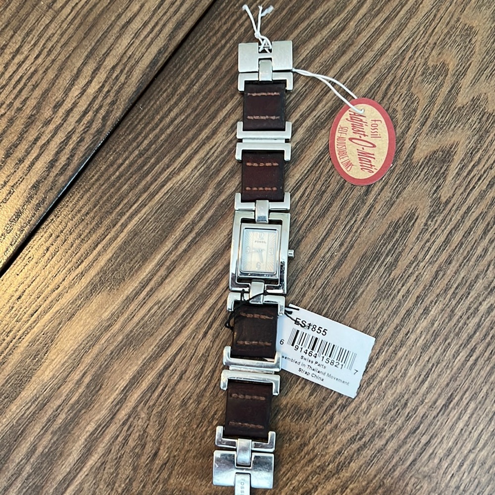 Fossil women’s bracelet watch with leather and steel band. Needs new battery.